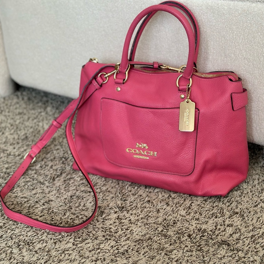 Pink Coach handbag with crossbody strap